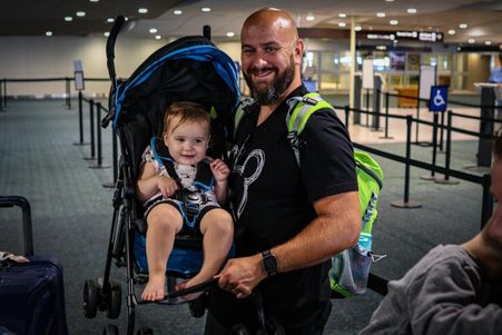 Man with his toddler at Mears Connect at MCO