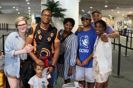 Large family ready to go on a Mears Connect shuttle